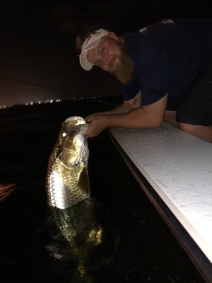 1 man with fish at night